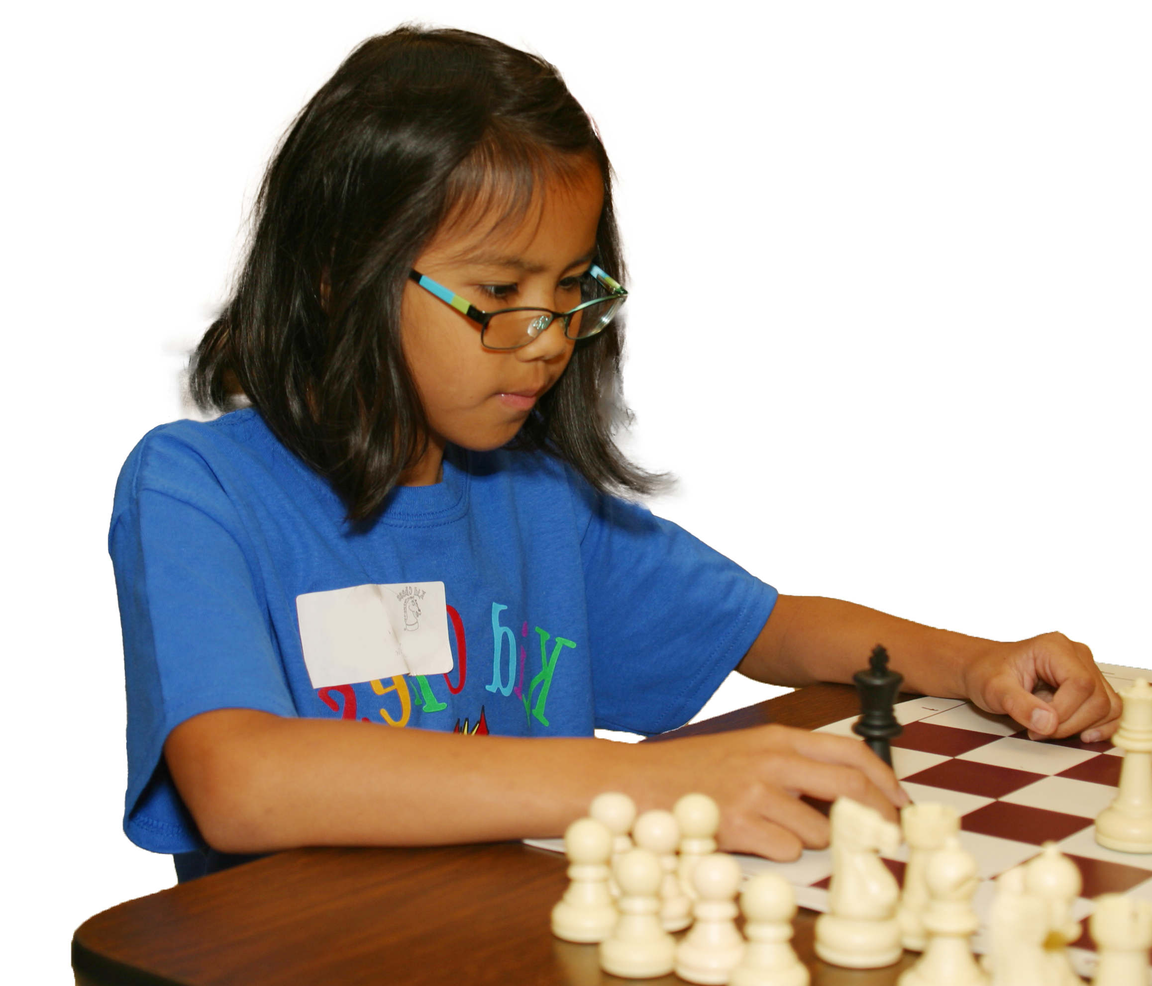 Little girl over a chess board.